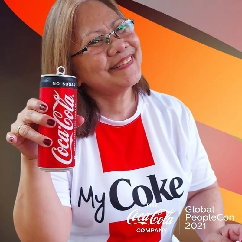 Photo booth snapshot of a guest in a My Coke shirt holding a no sugar can on a Coca-Cola PeopleCon frame