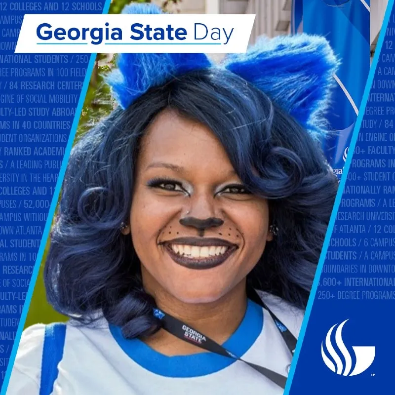 Photo booth snapshot of a guest in blue cat ears and face paint on a Georgia State Day frame
