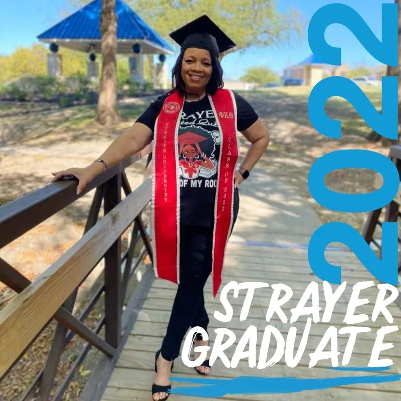 Photo booth snapshot of a graduate with a red stole on a Strayer Graduate 2022 frame