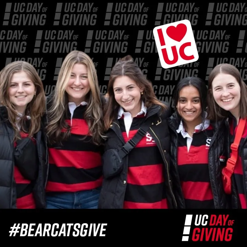 Photo booth snapshot of five students in rugby stripes on a UC Day of Giving frame