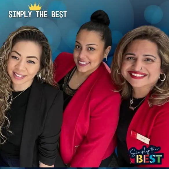 Photo booth snapshot of three colleagues in red blazers on a Simply the Best frame