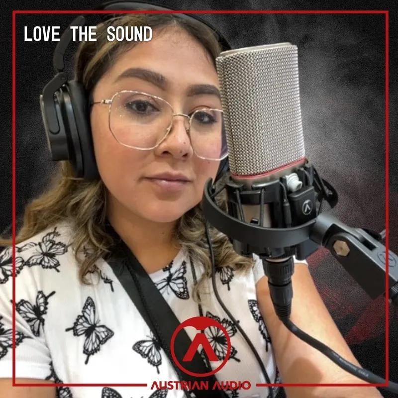 Photo booth snapshot of a guest in headphones beside a studio microphone on an Austrian Audio Love the Sound frame