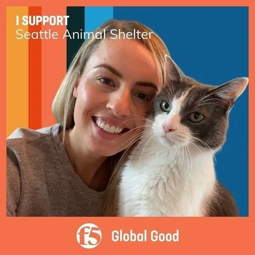 Photo booth snapshot of a guest with her cat on an F5 Global Good frame supporting the Seattle Animal Shelter