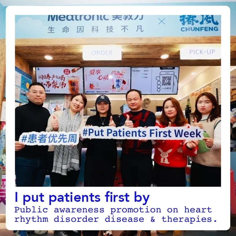 Photo booth snapshot of a team holding Put Patients First Week banners at a Medtronic awareness event in China