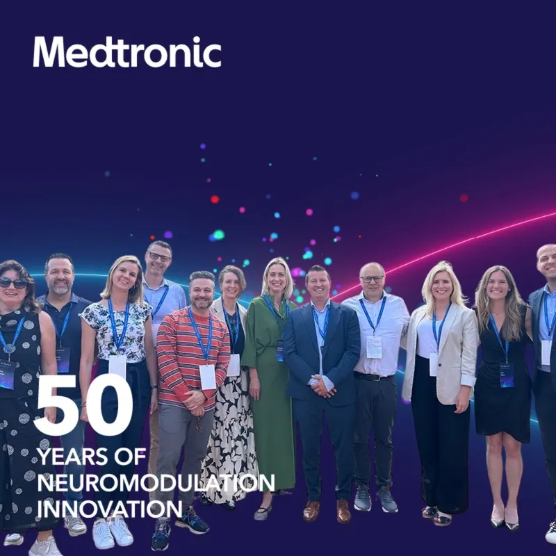 Photo booth snapshot of a Medtronic team on a 50 years of neuromodulation innovation frame