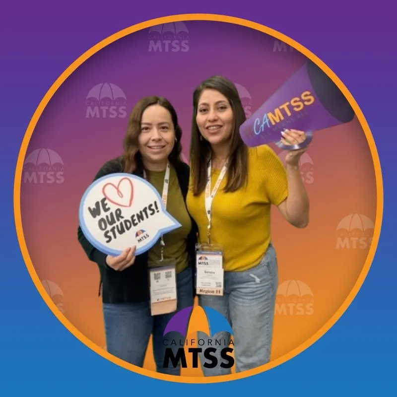 Photo booth snapshot of two educators with a We Love Our Students sign and megaphone on a California MTSS frame