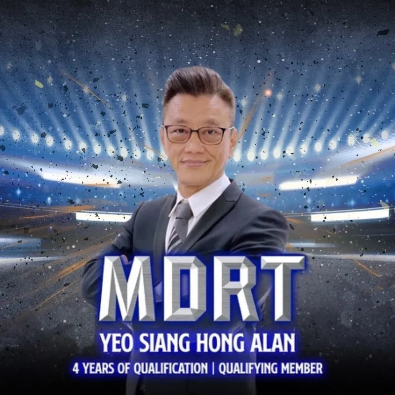Photo booth snapshot of a guest in a suit on an MDRT qualifying member frame with a stadium backdrop