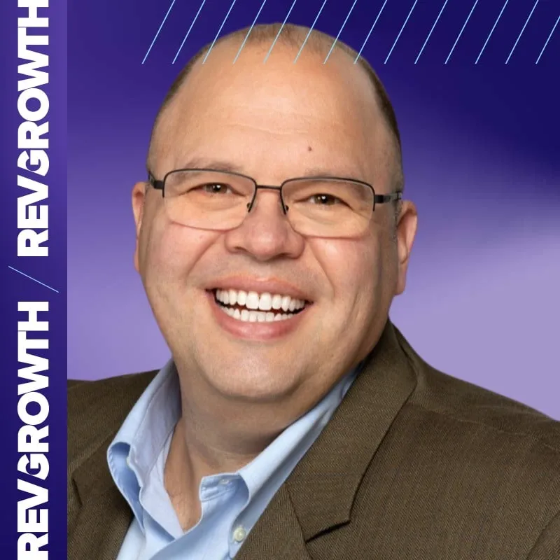 Photo booth snapshot of a smiling guest on a purple RevGrowth frame