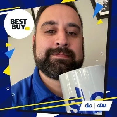 Photo booth snapshot of a guest holding an SLC mug on a Best Buy frame