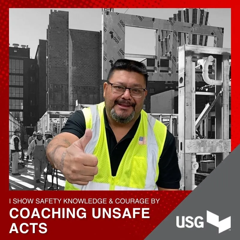 Photo booth snapshot of a worker in a safety vest giving a thumbs up on a USG coaching unsafe acts frame