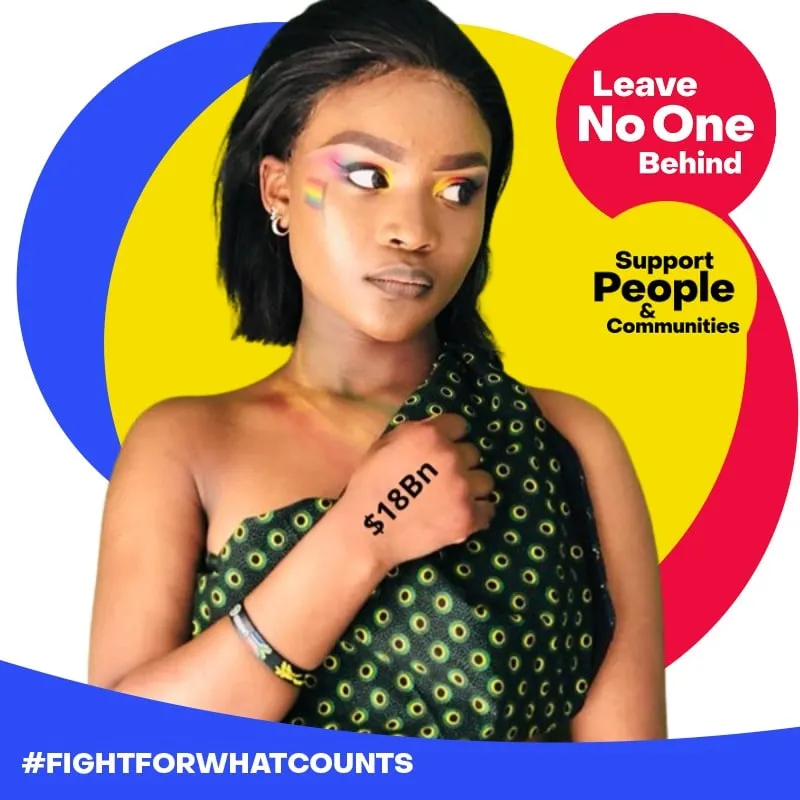 Photo booth snapshot of a guest with rainbow eye makeup on a Leave No One Behind Fight For What Counts frame