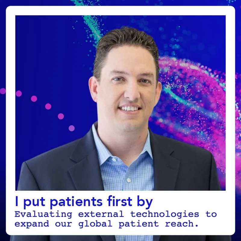 Photo booth snapshot of a guest on an I Put Patients First testimonial card about expanding global patient reach