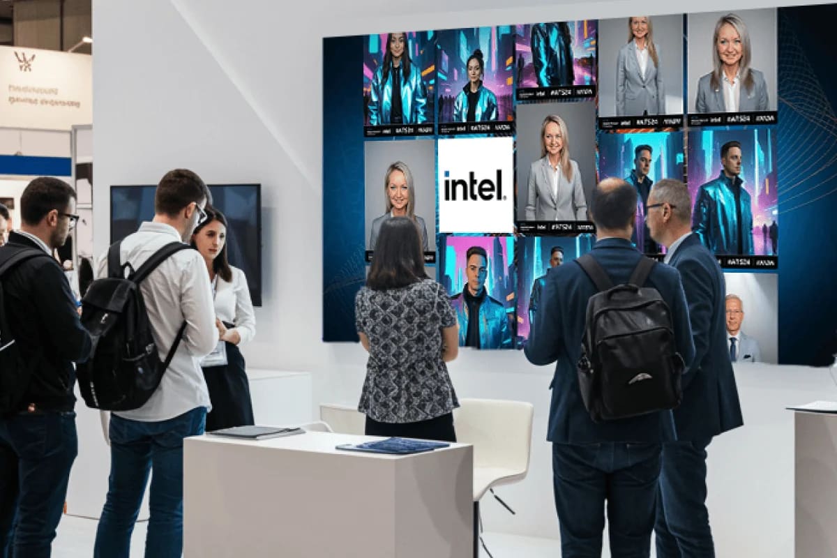 Conference attendees gathered at an Intel-branded photo activation wall on the expo floor