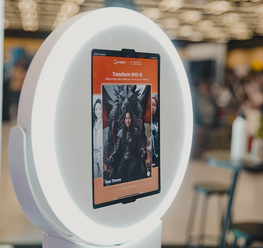 An iPad on a stand running a Snapbar activation at a corporate event, with guests joining from their own phones nearby.