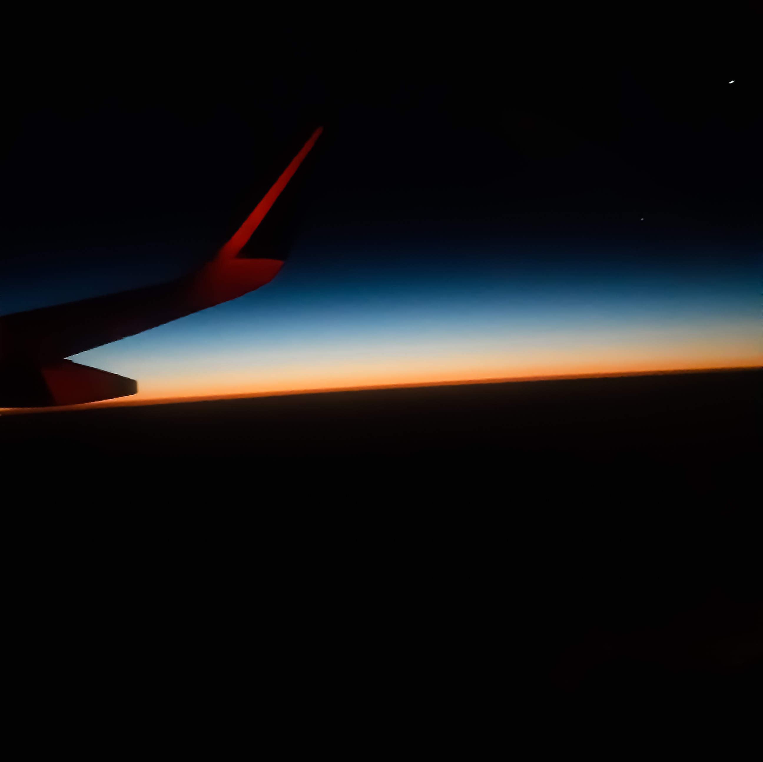 Dawn Over the Horizon Clicked in Airplane