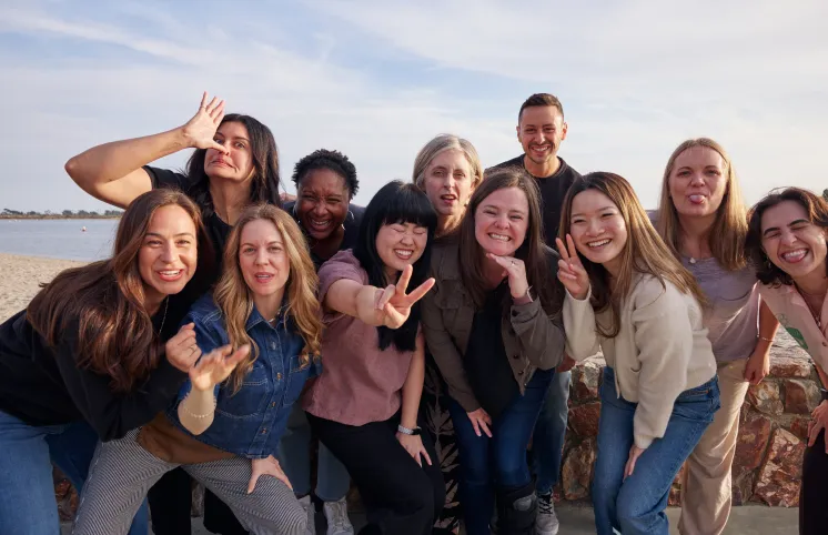 A group of team members making silly faces at the camera