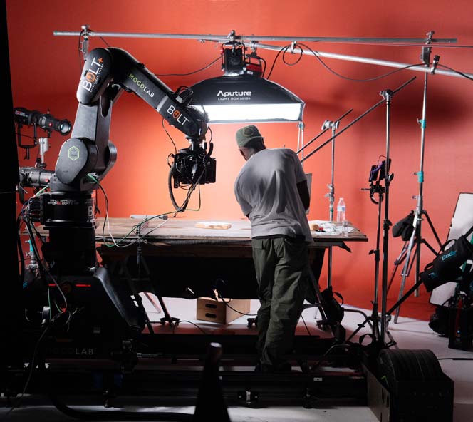 Behind-the-scenes tabletop food video production in Philadelphia with Bolt robotic camera arm and Aputure lighting — high-speed motion control cinematography by Big River Film Co. for premium food and beverage brands.