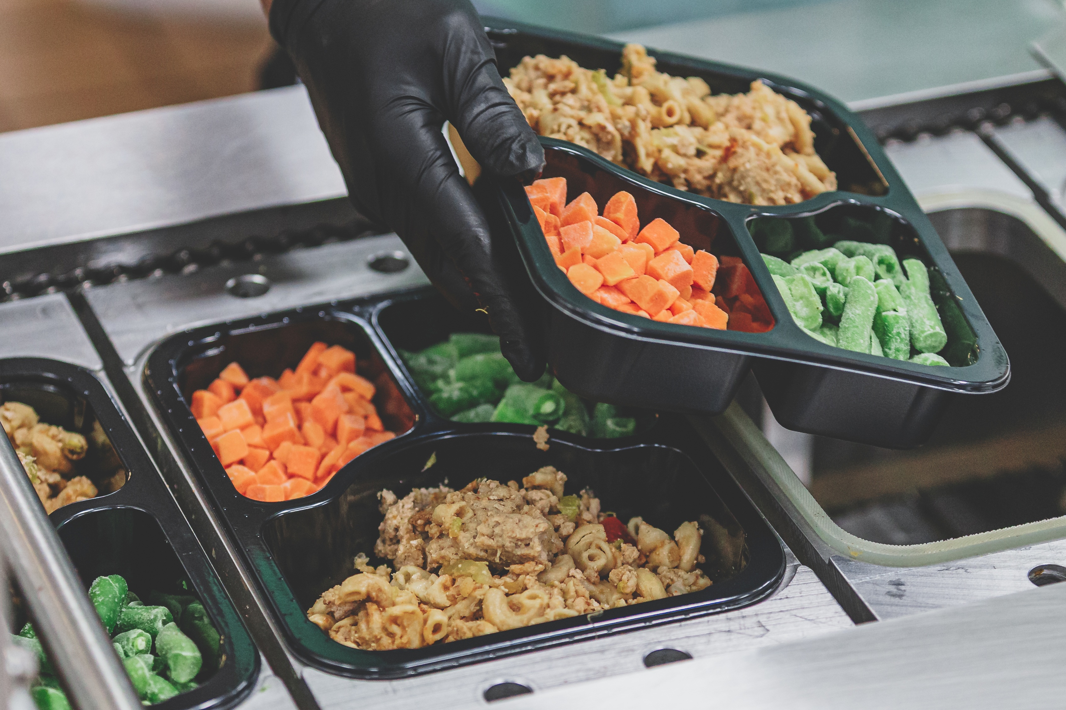 Volunteers packaging meals for delivery