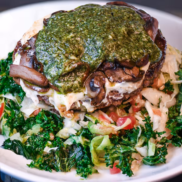 Magic Shroom Burger over a tossed house greens