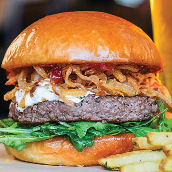 Force of Nature 100% Grass-Fed Pasture Raised Bison, Cherry & Fig Honey Jam, Crispy Onions, Goat Cheese & Dressed Arugula.