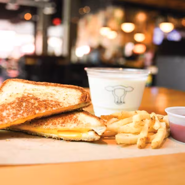 Grilled Cheese on Texas Toast, served with hand-cut fries, ketchup & your choice of kid's drink..