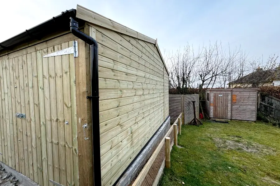 Bespoke timber carriage house with open parking bay