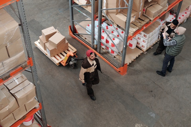 man moving warehouse inventory