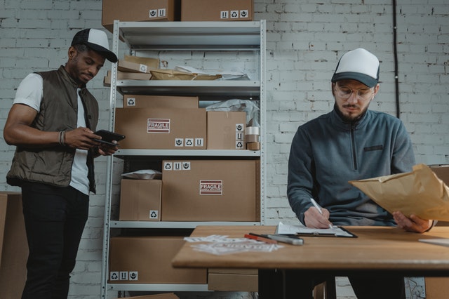 two men managing inventory