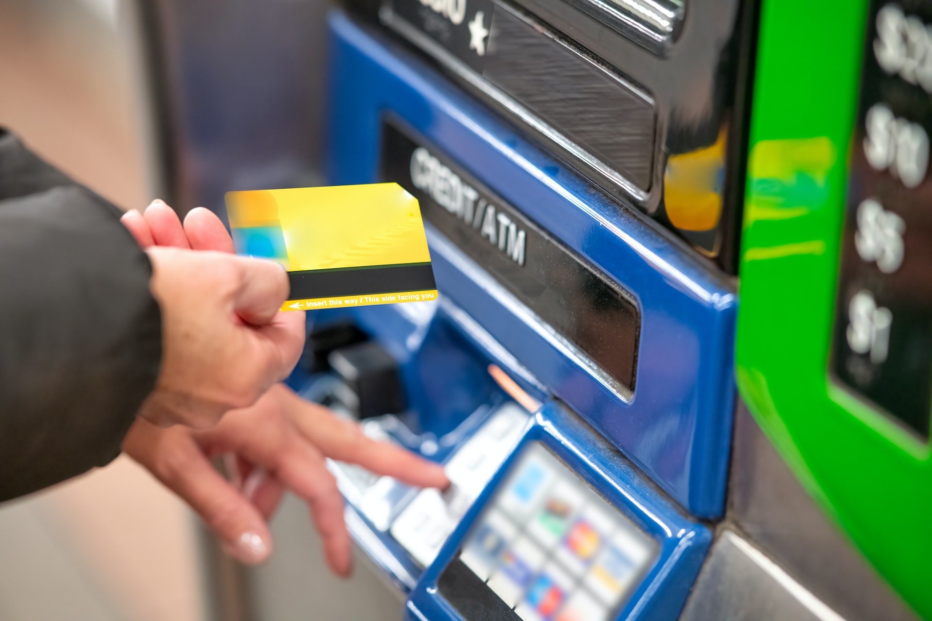 A cardholder using an ATM