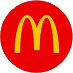 A yellow McDonalds logo on a red circle background