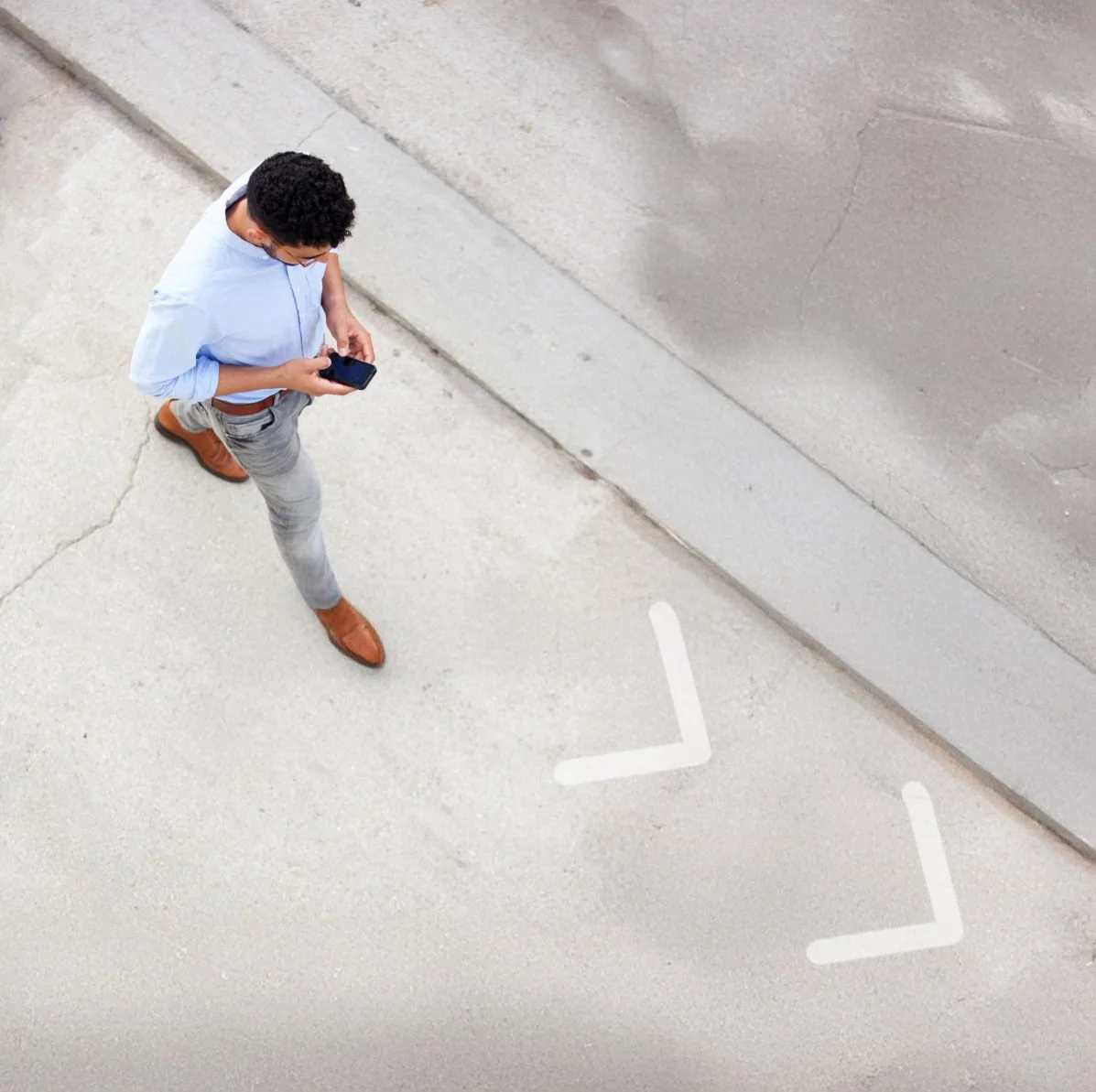 A blurry image of a busy office, with employees walking around the open office landscape
