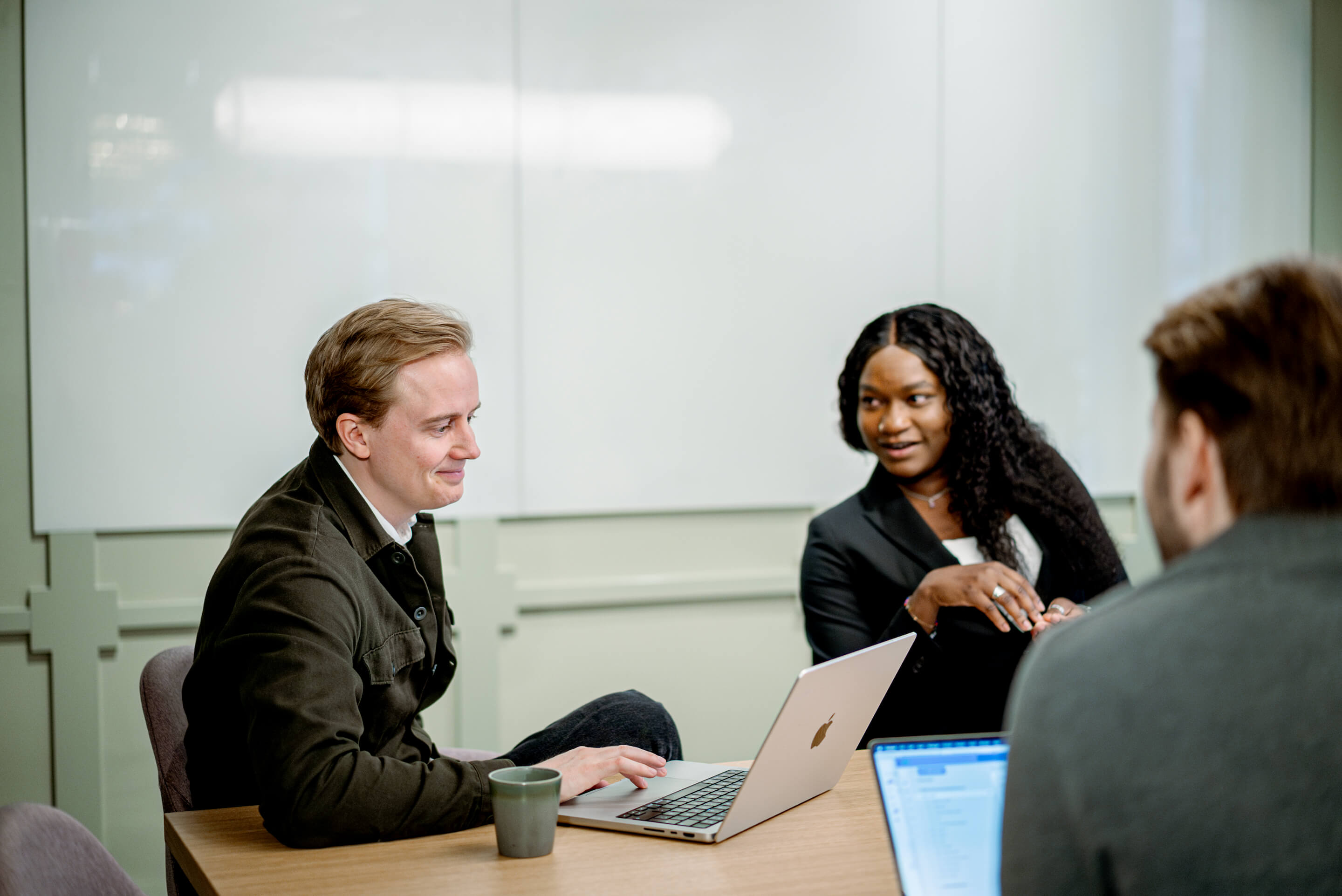 Exelement colleagues discussing operations strategies during a team meeting