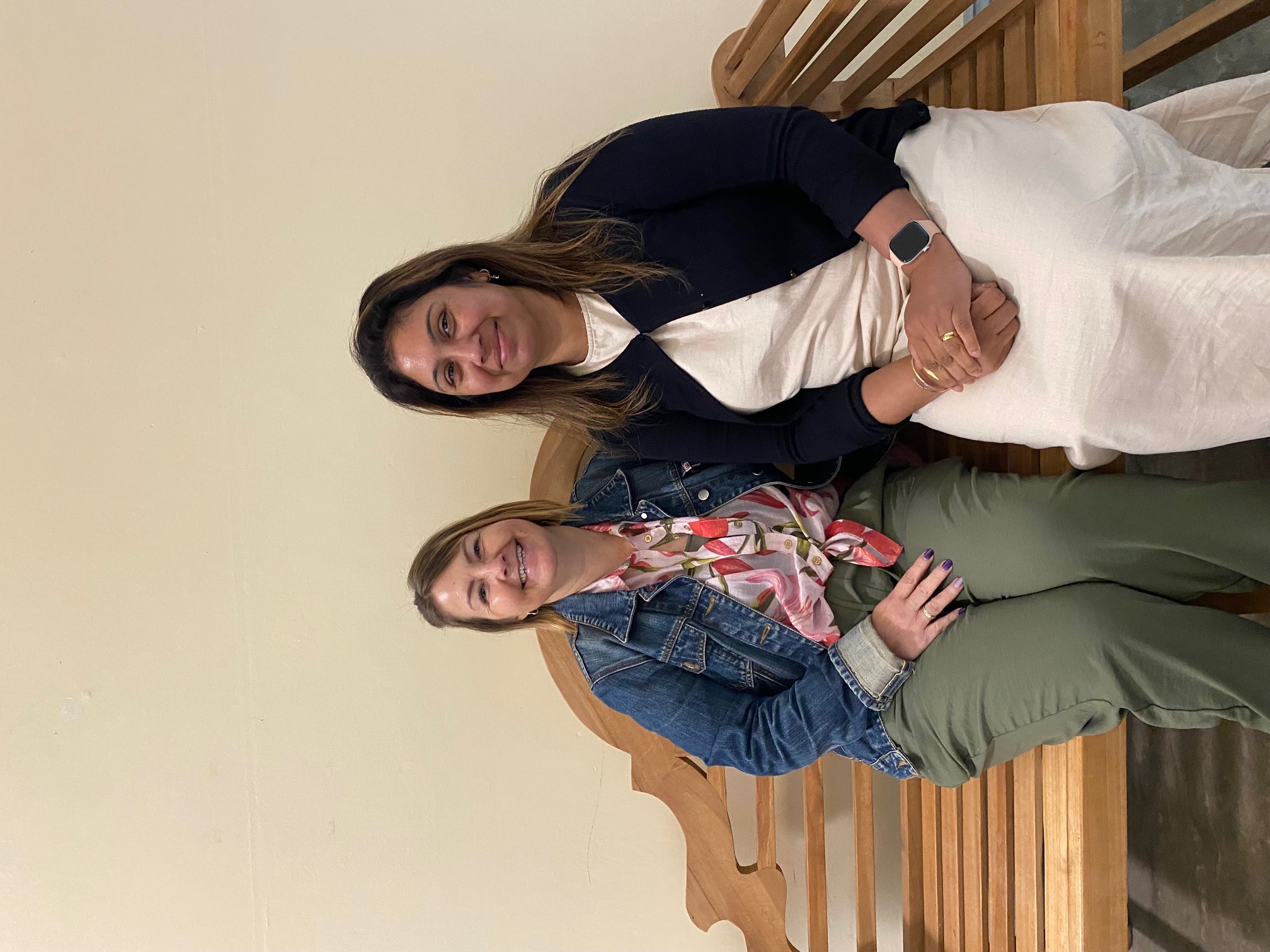Two ladies sitting on a bench