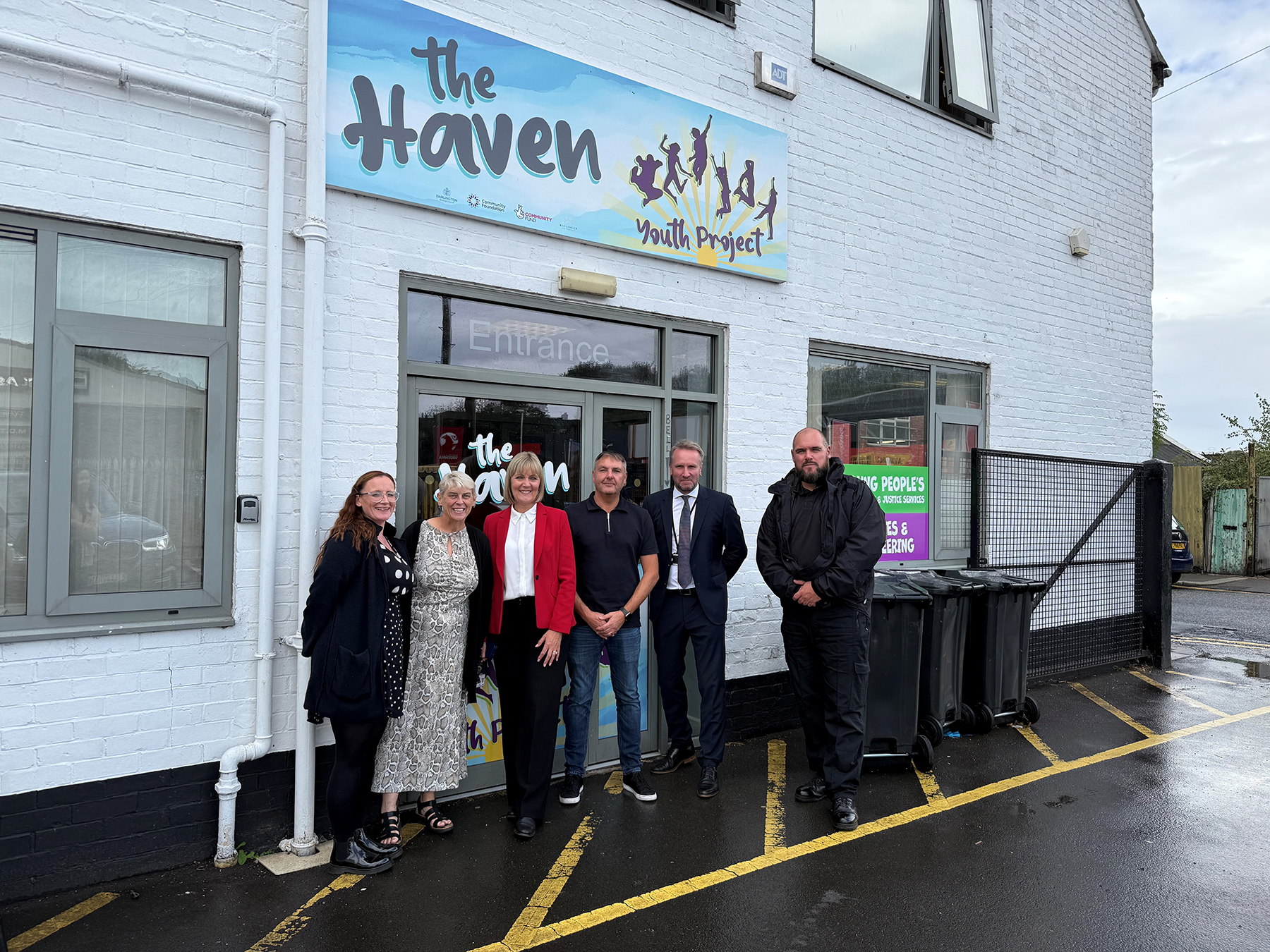 A group of people, incluiding the PCC, standing outside The Haven building
