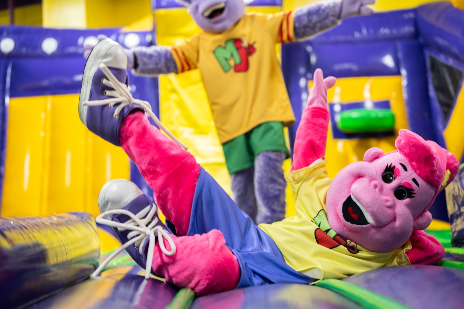 Mascots posing at Monkey Joe's, an inflatable play center in Orlando, Florida.
