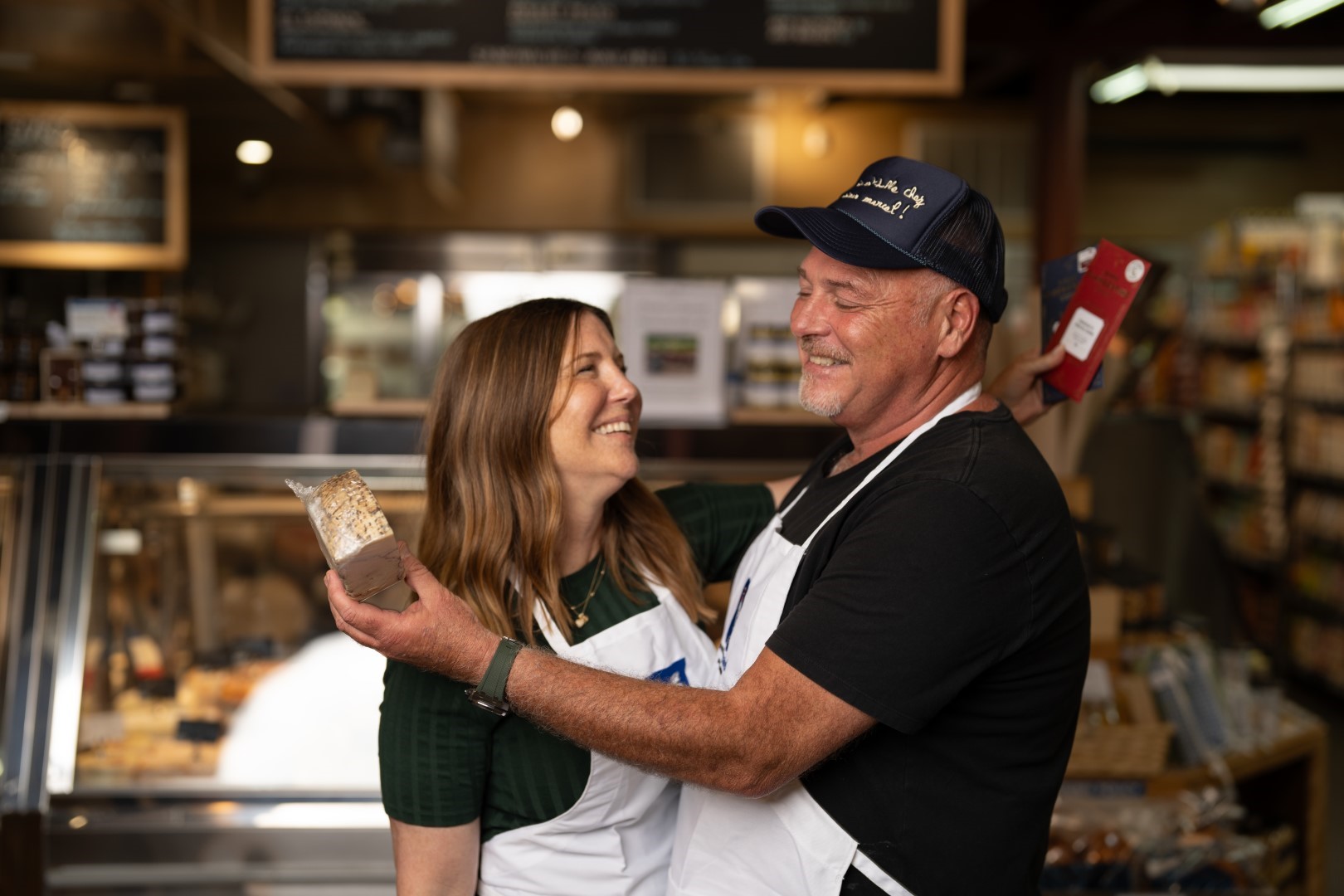 Owners of Monsieur Marcel pose for U.S. Bank's Small Business, Big Ambition video production.