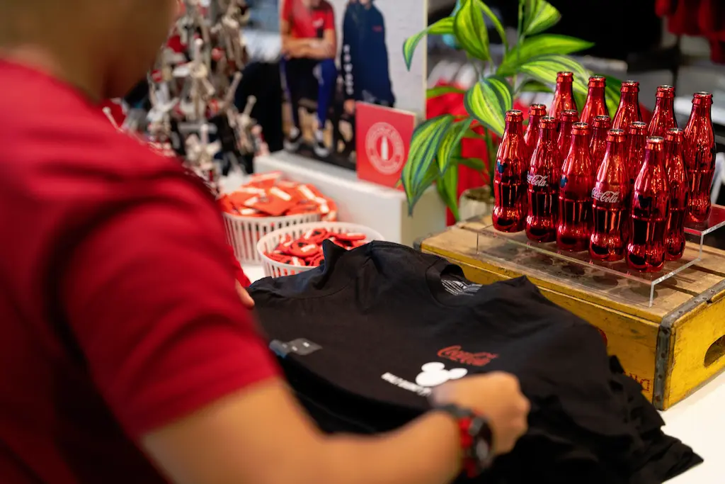 View of Coca-Cola products set up for training video.