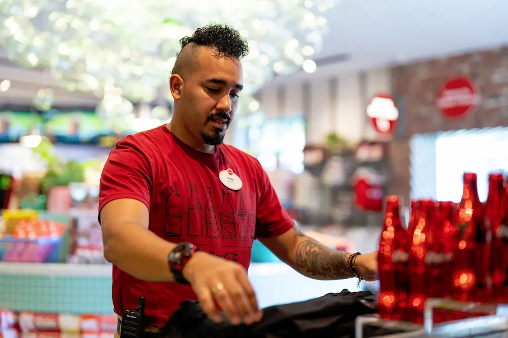  Coca-Cola employee posing for training video.