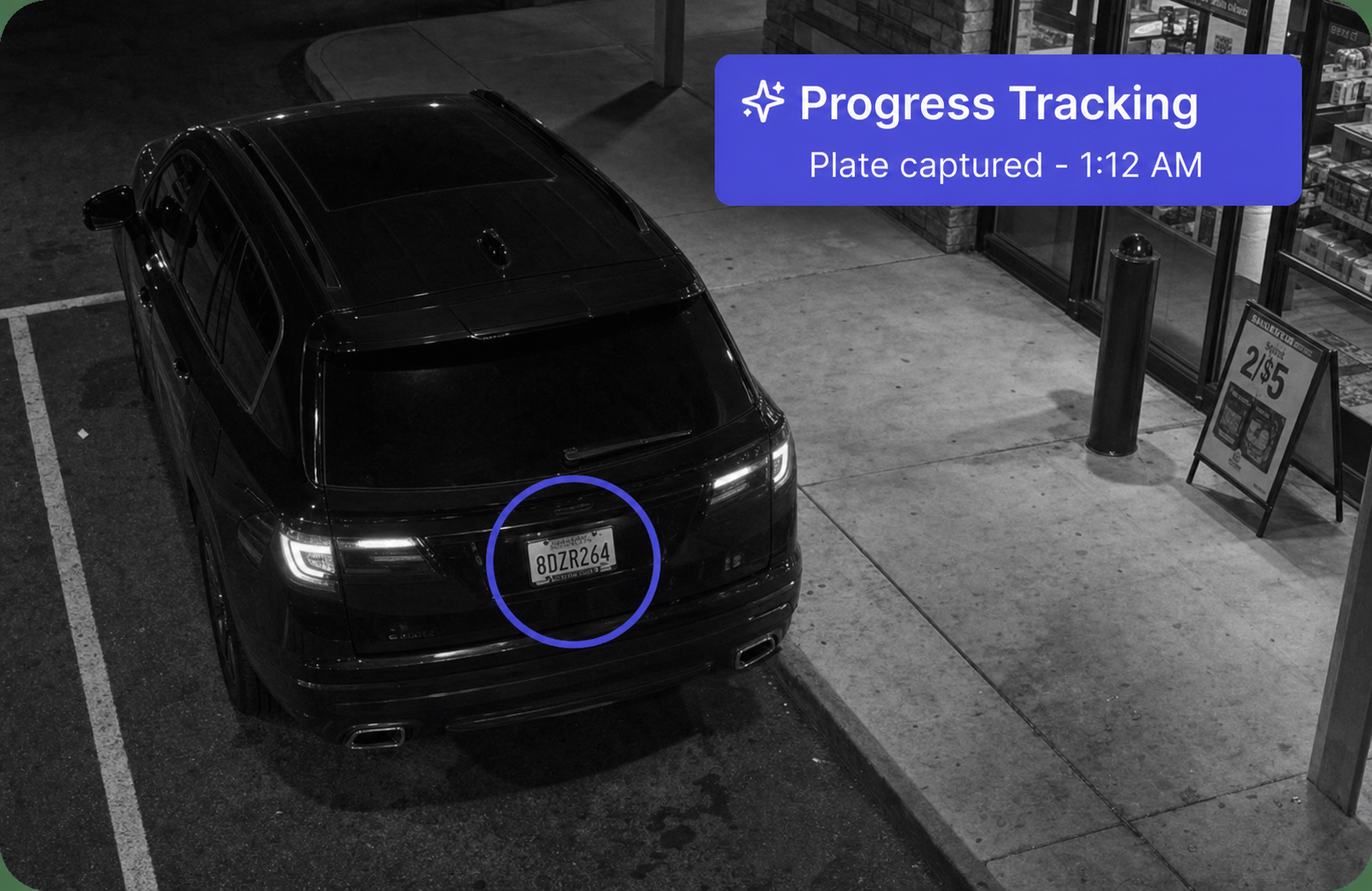 License plate of interest captured on a vehicle near the store entrance at night
