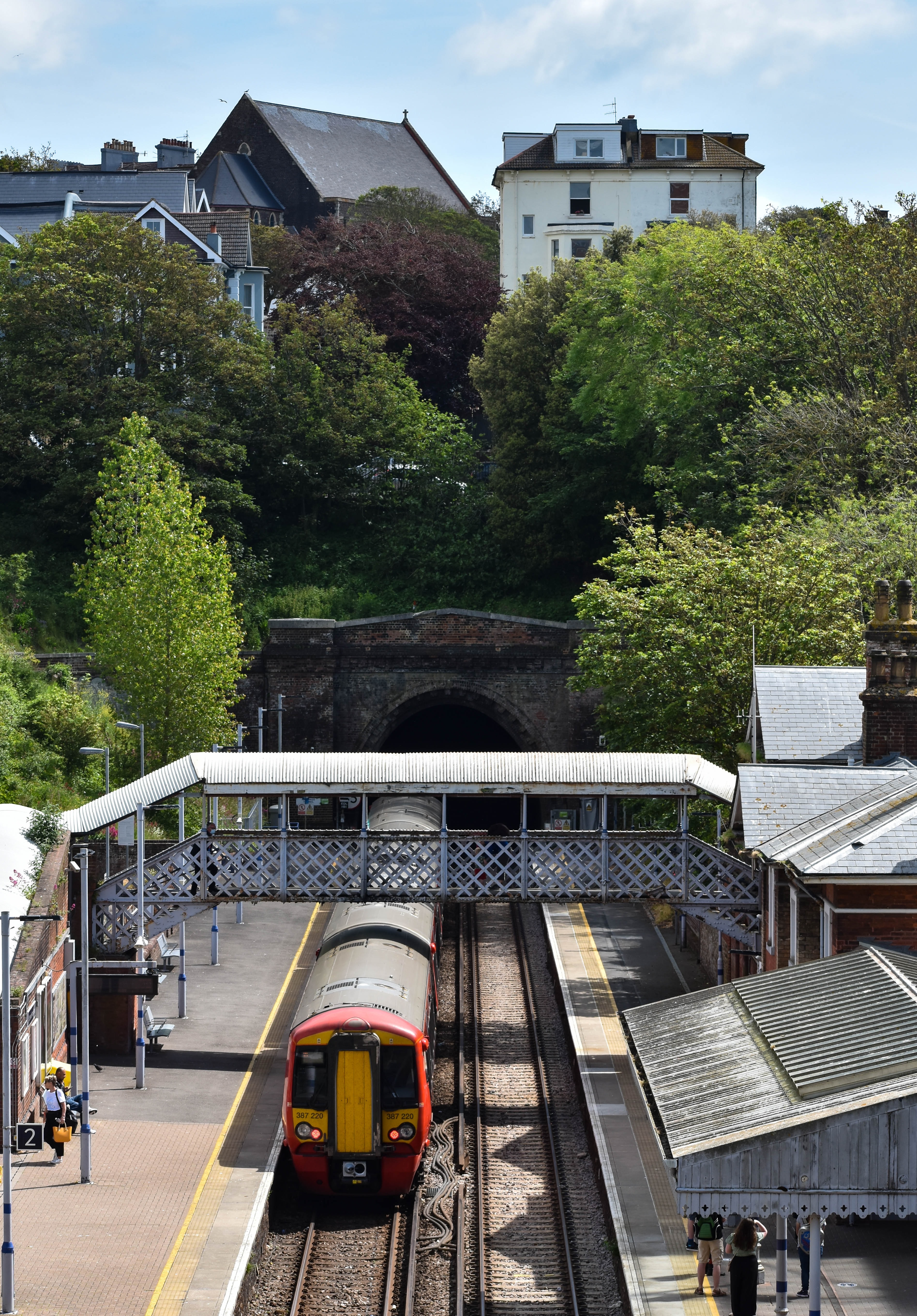 A landscape of a British town with a train