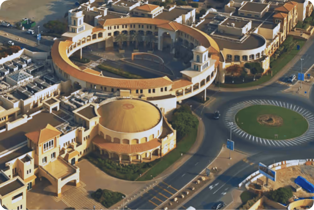 An aerial view of a large building with a dome.