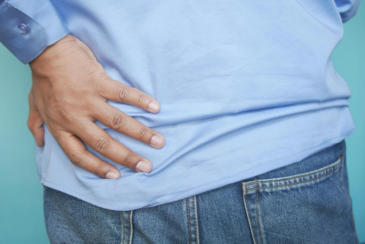 anonymous person with hand on hip
