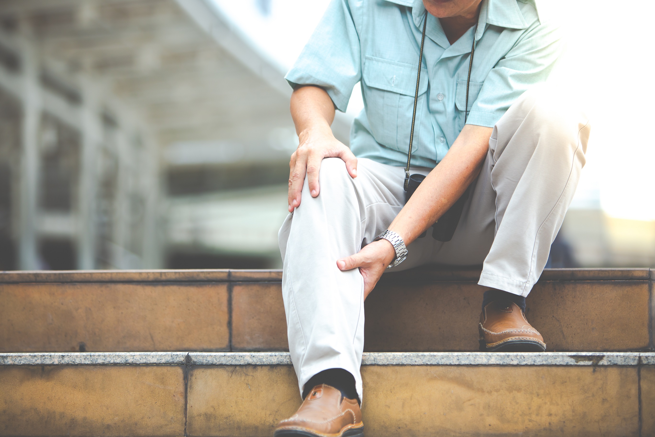 Senior person experiencing knee joint pain