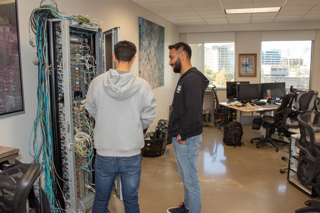 AboutIT technician visiting a client's office to troubleshoot on-site IT issues