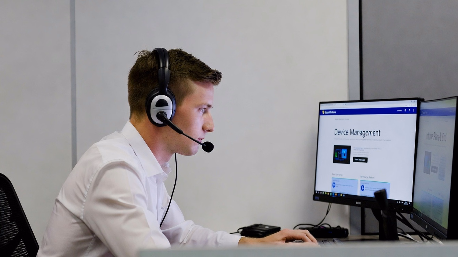 HELP DESK COUNTER An IT professional one person at a help desk counter with