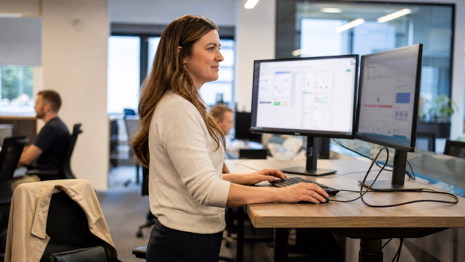 Woman at standing desk reviewing Intune console