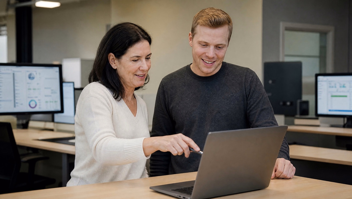 IT pros review firewall config on laptop screen