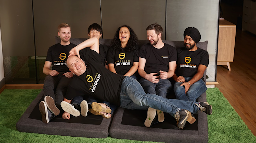 The founding team laughing and posing for a silly photo.