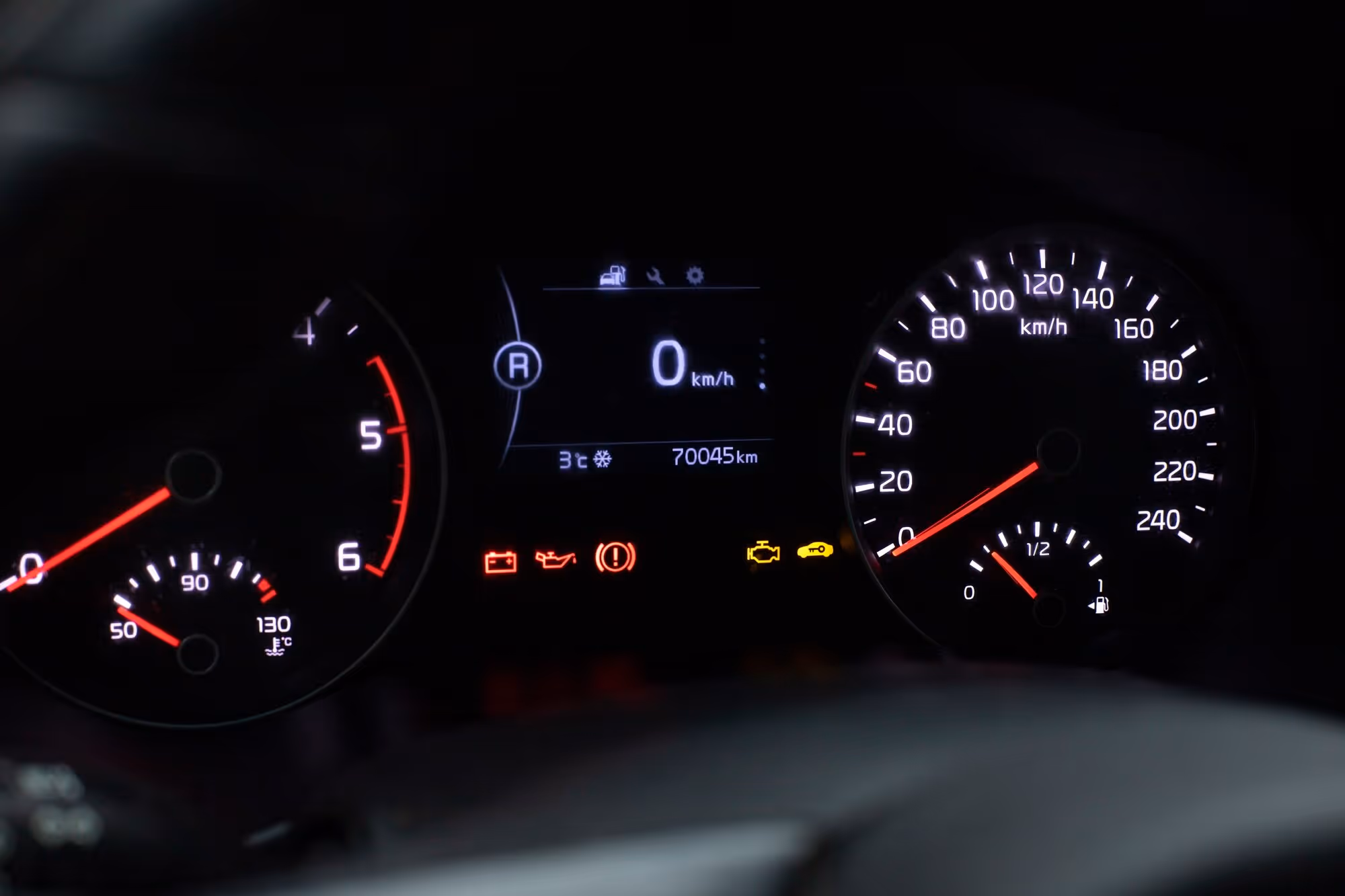 Close-up of a vehicle dashboard gauge, illustrating Tesla collision avoidance technology