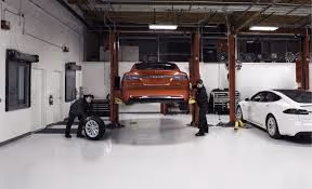 Tesla owner comparing repair shops before choosing one